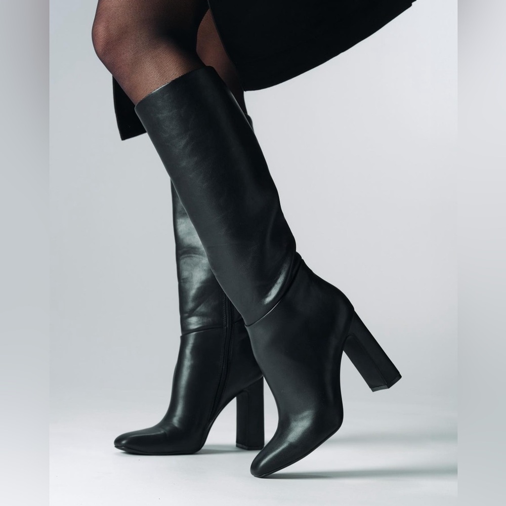 Black leather Steve Madden “Ally” Boot. Size US 7.5. Ankle zipper closure.